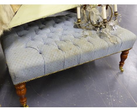 A LARGE BUTTON UPHOLSTERED FOOTSTOOL ON TURNED LEGS.   L.105 x W.69cms.