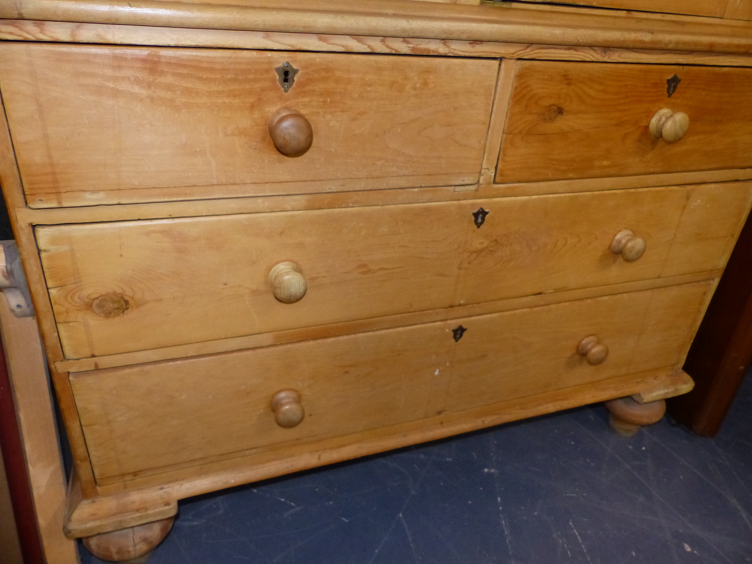 A 19th.C.PINE LINEN PRESS WITH PANEL DOORS ENCLOSING SHELVES OVER TWO