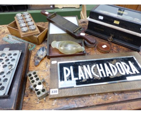 AN ANTIQUE MAHOGANY AND BRASS PILL ROLLER, A SCIENTIFIC BALANCE BY TRAIL & FLETCHER, LOWESTOFT, VARIOUS PILL MOULDS AND SCOOP