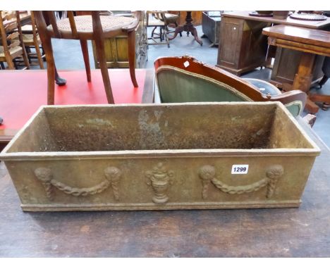 A SMALL CAST IRON GARDEN PLANTER WITH SWAG AND URN DECORATION.