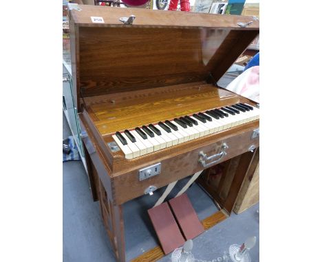 A GOOD QUALITY OAK CASED PORTABLE HARMONIUM PEARL RIVER , COLLAPSES INTO SELF CONTAINED CARRY CASE.