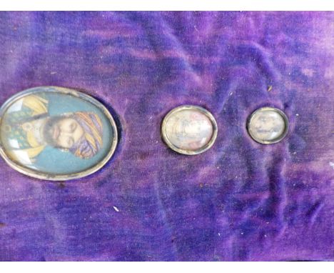 THREE INDO PERSIAN OVAL PORTRAIT MINIATURES OF GRADUATED SIZE IN A FITTED CASE.   LARGEST 4.5 x 3.5cms.
