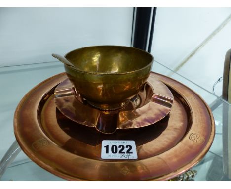 A COPPER ARTS AND CRAFTS CARD TRAY BY THE BIRMINGHAM GUILD,LTD, A SIMILAR ASHTRAY WITH IMPRESSED MARKS AND A BOWL AND SPOON O