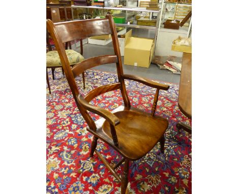 A LARGE VICTORIAN LADDER BACK KITCHEN ARMCHAIR.