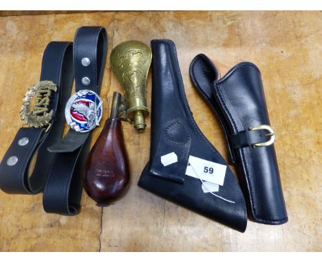 AN ANTIQUE LEATHER SHOT FLASK, A BRASS POWDER FLASK, TWO WESTERN STYLE LEATHER HOLSTERS AND BELTS.