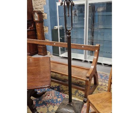 An Art Deco period Continental Bronze floor lamp with adjustable swing form light fitting