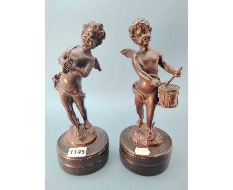 Auguste Moreau (1834-1917), a pair of bronze amoretti, one playing a drum and the other cymbals, both stand on cylindrical pl