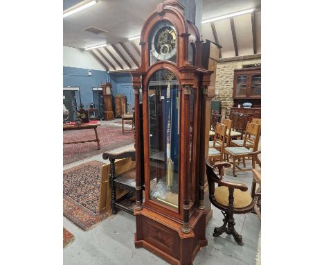A rare Remontoir long-cased center piece clock with the silvered chapter ring over a skeleton movement striking and chiming o