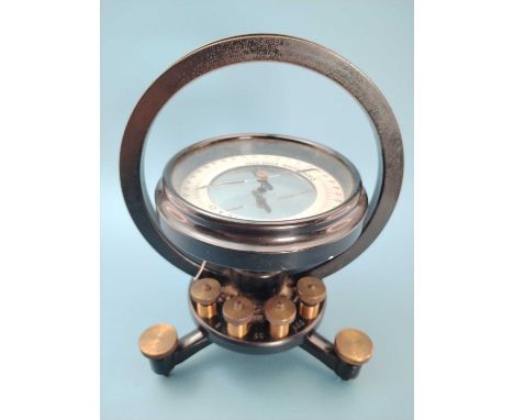 A Pye of Cambridge tangent galvanometer, the blackened housing on three adjustable feet