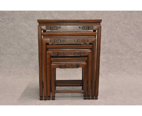 A nest of four Chinese hard wood tables, the rectangular tops above carved aprons and square sectioned legsThey are a one man