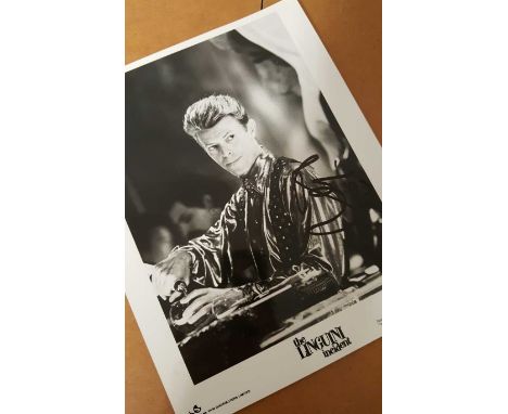 David Bowie autographed photo. Very rare black and white 8x10 Rank Film still from the movie The Linguini Incident, autograph
