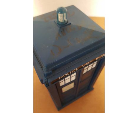 David Tennant and Freema Agyeman signed Tardis. 15cm high model of the Tardis from Doctor Who autographed on the top by David