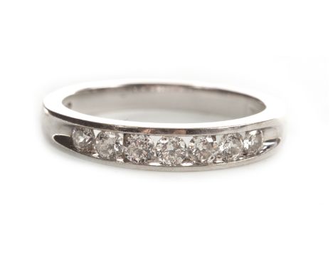 DIAMOND SET BAND, by Forever Diamonds, with channel set round brilliant cut diamonds totalling very approximately 0.30 carats