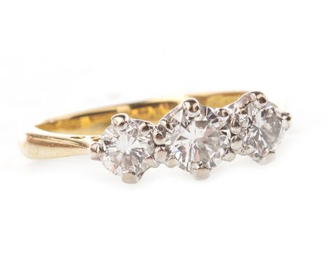 DIAMOND THREE STONE RING, set with round brilliant cut diamonds totalling approximately 0.55 carats, in eighteen carat gold, 