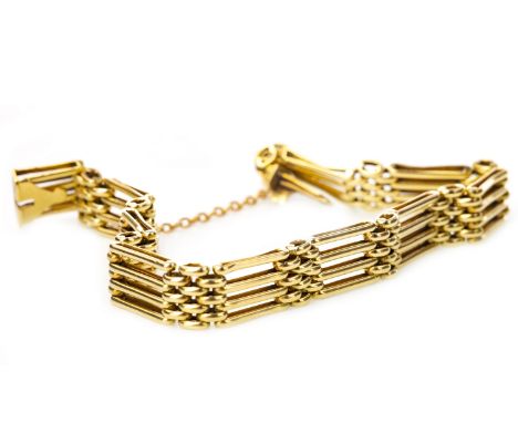 EARLY TWENTIETH CENTURY GATE LINK BRACELET, formed by bar and oval links, marked 15ct, with safety chain, 15.2g