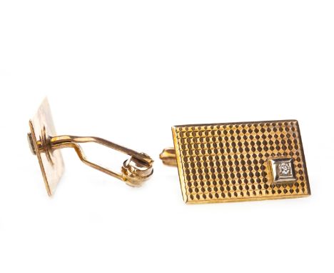PAIR OF NINE CARAT GOLD CUFF LINKS, each with a rectangular panel 20mm long, set with a single diamond, 6.8g gross