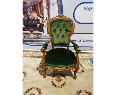 A French Louis Xv Style Walnut And Upholstered Fauteuil Armchair With Cartouche Shaped Back And Paterae Carved Cresting, The 