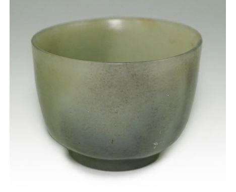 A Chinese pale celadon jade cup, 18th / 19th century, the stone with some black speckling, 4.2cm highProvenance - A. V. K. Mu