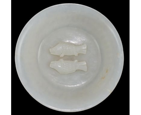 A fine Chinese white jade 'twin-fish' bowl, Qianlong period (1736-95), the shallow bowl with spreading foot and slightly flar