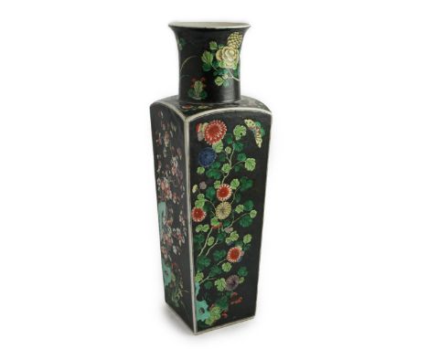 A large Chinese famille noire square baluster vase, 19th century in Kangxi style, painted to each side with birds amid prunus