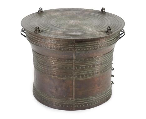 A large Sino-Shan bronze rain drum, Shan States, East Burma, 19th century, the cast concentric ring top with central star mot