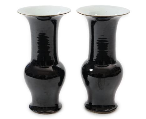 A pair of large Chinese mirror black glazed yen-yen vases, Kangxi period (1662-1722), with brown glazed rims, white glazed ba