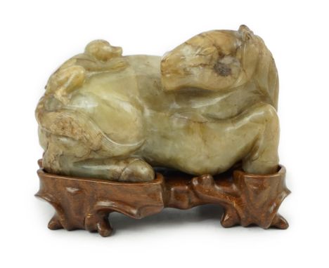 A Chinese celadon and mottled brown jade figure of a monkey climbing on a recumbent horse, Ming dynasty, 16th-17th century, t