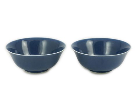 A pair of Chinese powder blue glazed bowls, Daoguang mark and of the period (1821-50), each with a white glazed rim and foot 