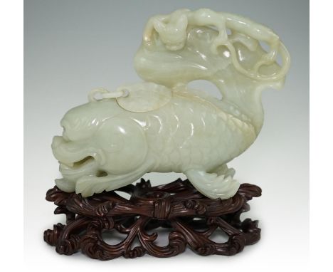 A large Chinese pale celadon jade ‘dragon-fish’ vessel and cover, 19th century, with a small chain-linked cover to the top of