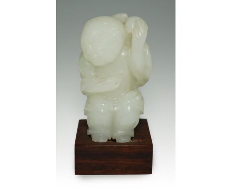 A Chinese white jade figure of Liu Hai, 18th-19th century, the standing figure carved in relief and openwork with the three l
