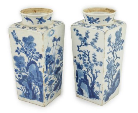 A pair of Chinese blue and white square section vases, Kangxi period, each side variously painted with flowering peony, prunu