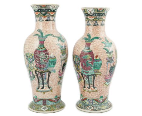 A near pair of Chinese famille rose ‘Hundred Antiques’ baluster vases, Kangxi mark, early 20th century, each painted with ant
