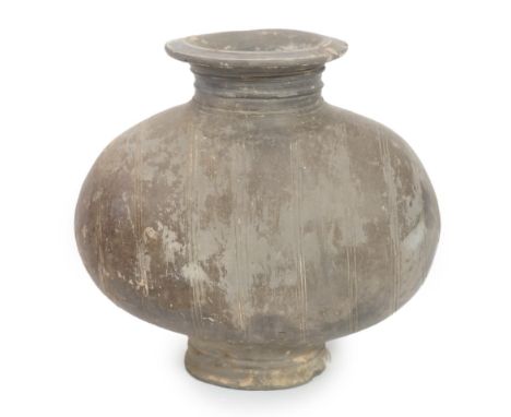A Chinese incised and burnished pottery cocoon jar, Western Han Dynasty (206 BC-AD 8), the burnished surface decorated with t