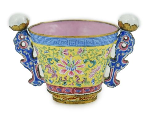 A Chinese Guangzhou enamel two handled wine cup, four character Qianlong mark and of the period (1736-1795), painted in vibra