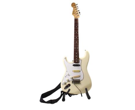 A Fender Squier Stratocaster left handed electric guitar E Series, E724 81 cream finish with maple neck and rosewood fret boa