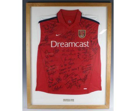 A replica Arsenal F.C. home shirt for the 2001/02 double winning season, signed by various players all dedicated to Dr Taylor