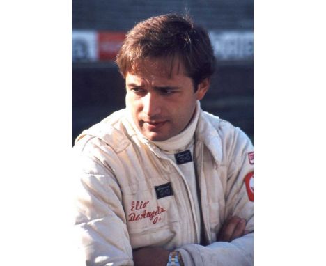 Elio de Angelis (1958-1986), a Lotus Formula One racing suit, in cream with embroidered name to right chest pocket and labels