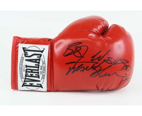 Frank Bruno, an Everlast red leather boxing glove signed in black marker "Best Wishes Frank Bruno", together with two ticket 