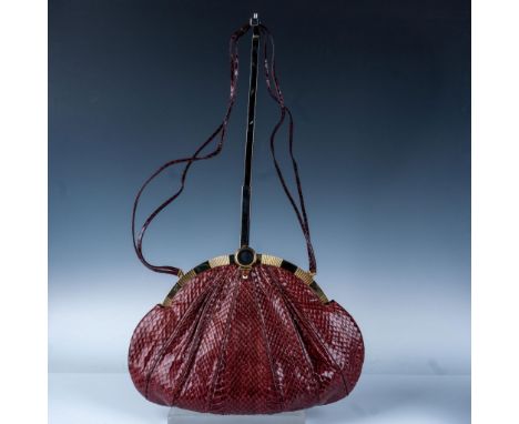 This luxurious burgundy snake-embossed clutch exudes vintage charm with its structured pleated design and polished gold-tone 