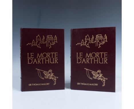 A set of 2 books in a dark brown leather cover with light brown ribbon bookmarks. The covers are adorned with a gilded illust