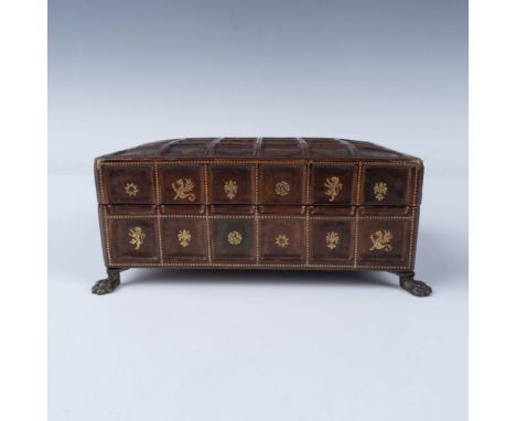 A stunning rectangular wooden desk box covered in deep red-brown leather, featuring a decorative grid of square panels, each 