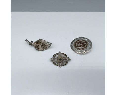 Darling collection of brooches that includes a sterling silver leaf decorated with three roses and backstamped 925 weighing l