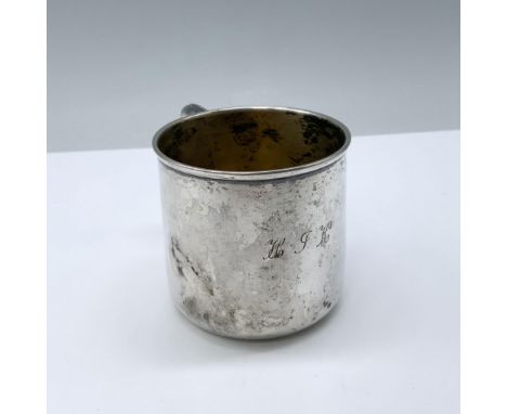 Minimalist baby cup with charming handle and smooth finish with the letters H I K engraved; measuring: WM Rogers and Son back