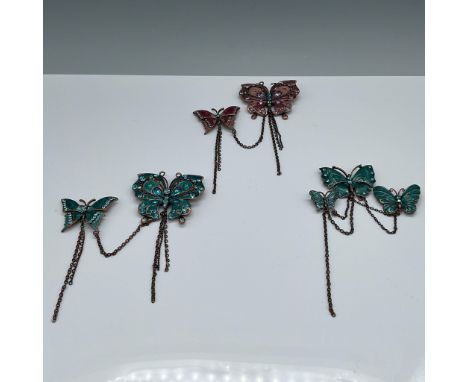 This set includes three beautiful pins, each featuring multiple butterflies. The designs are adorned with colored enamel and 