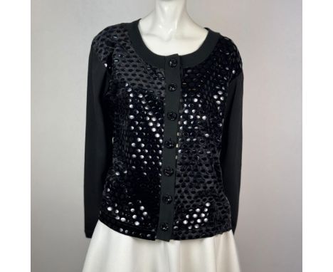 Stylish button up black cardigan with an oval neckline and oval reflective patterned decor on the vest of the jacket. Rectang