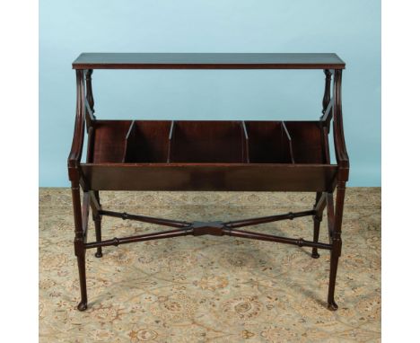 Five deep angled compartments sit below a top shelf. It is all raised on ring-turned legs joined by an X stretcher. Issued: 1