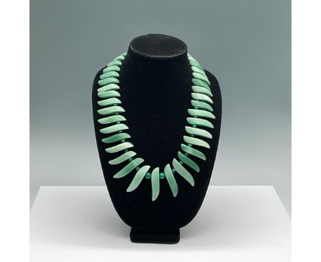 This striking necklace features polished green aventurine blades, elegantly arranged with round malachite spacer beads. The a
