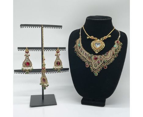 A remarkable jewelry lot featuring an ornate Indian bridal jewelry set and an Elizabeth Taylor for Avon heart pendant necklac