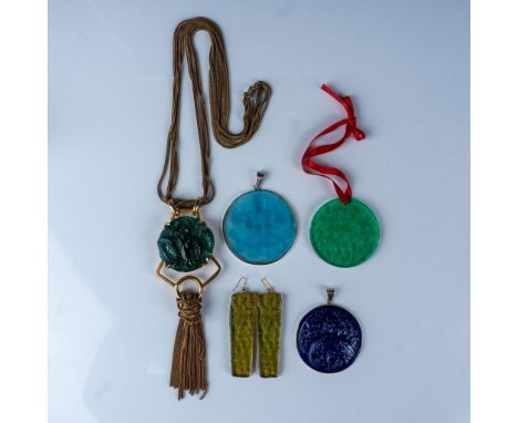 This grouping features a pair of moss green plastic earrings and four decorative pendants/ornaments in various colors, each s