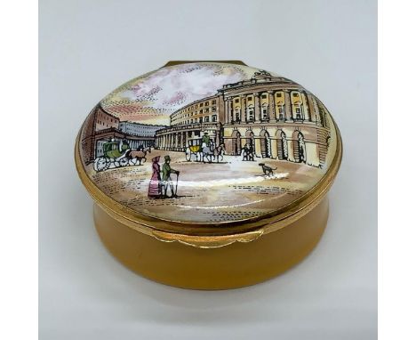 This miniature enamel oval box is dedicated to the famous Regent Street in London, featuring a beautiful period scene on the 